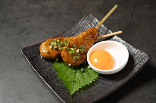 a plate of food with chicken wings and a dipping sauce at ホテル ブルジュア 久留米 Hotel Bvljua -レジャーホテル- in Kurume