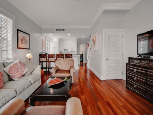 a living room with a couch and a table at Valentines Resort & Marina in Harbour Island