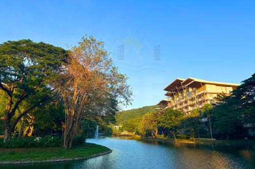 a river with trees and a building in the background at PICO DE LORO Nearest to Pool JACANA 2 Bedroom Units by SEE Condominiums in Cutad