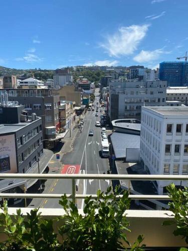 a view of a city street with cars and buildings at Cosy Penthouse Apartment in Wellington