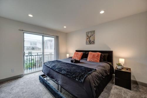 a bedroom with a large bed and a large window at Perfect Stay King bed Free Parking Free Wi-Fi in Houston