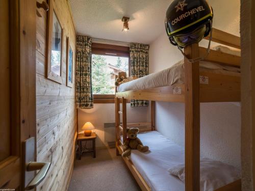 a room with two bunk beds and a teddy bear at Appartement 3 pièces avec Balcon et Wi-Fi proche piste à Courchevel - FR-1-575-3 in Courchevel