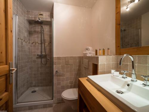 a bathroom with a sink and a shower and a toilet at Appartement 3 pièces avec Balcon et Wi-Fi proche piste à Courchevel - FR-1-575-3 in Courchevel