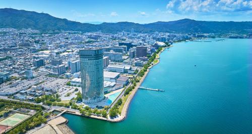 an aerial view of a city next to a body of water at Lake Biwa Otsu Prince Hotel in Otsu