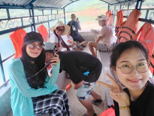 a group of people riding on a bus at Hue Lovely Homestay in Hue