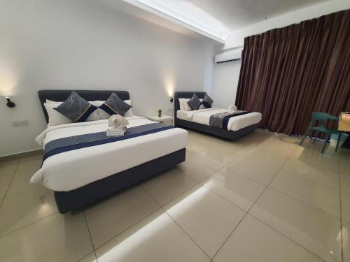 Ένα ή περισσότερα κρεβάτια σε δωμάτιο στο Swan Garden Resort Hotel