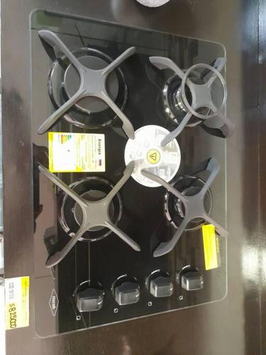 a display case with four pairs of scissors at Lindo y moderno apto con vista a la montaña in Buga