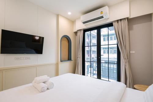 Ένα ή περισσότερα κρεβάτια σε δωμάτιο στο Moon House BKK Room 3A