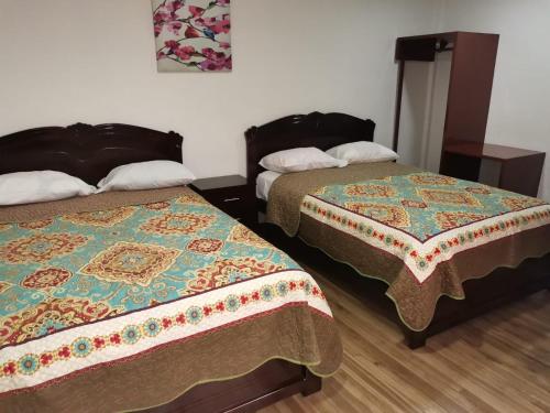 Postel nebo postele na pokoji v ubytování Hostal Palma