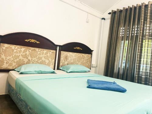 Postel nebo postele na pokoji v ubytování Tristar beach hotel