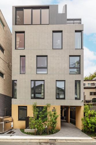 an apartment building with many windows at 67 Apt Kagurazaka Premium in Tokyo