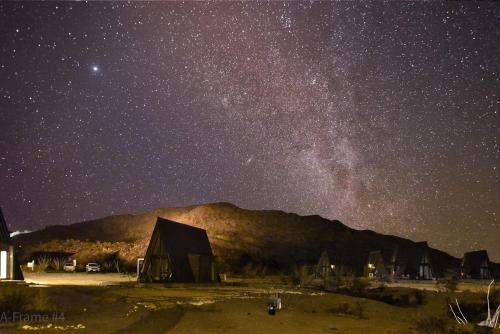 a starry night with a barn and the milky way at Stardust Big Bend Luxury A-Frame#4 great views in Terlingua