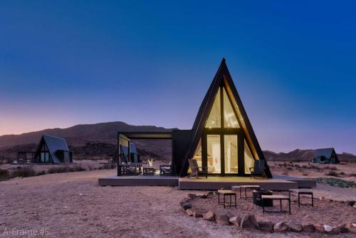 a glass house in the middle of the desert at Stardust Big Bend Luxury A-Frame#4 great views in Terlingua
