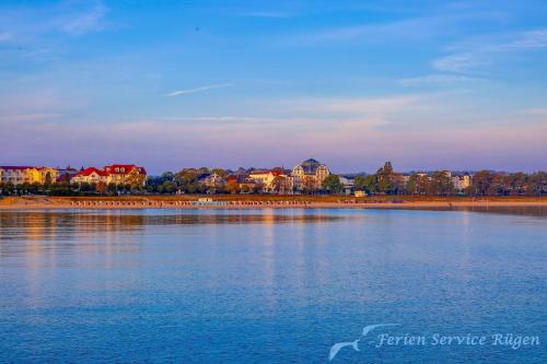 a large body of water with buildings in the background at Villa Seiler Fewo 6 in Binz
