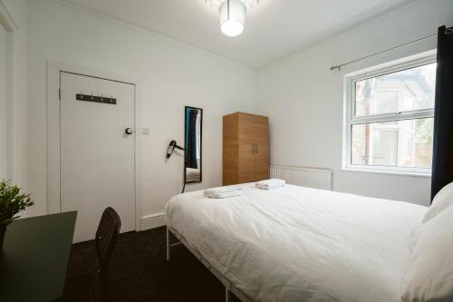 Ένα ή περισσότερα κρεβάτια σε δωμάτιο στο Barking Cosy Double Rooms