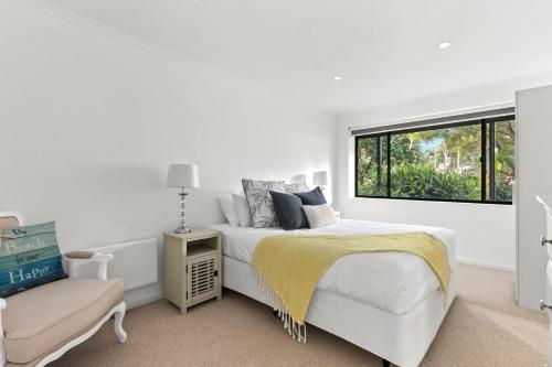 Ένα ή περισσότερα κρεβάτια σε δωμάτιο στο The Pambula Beach House