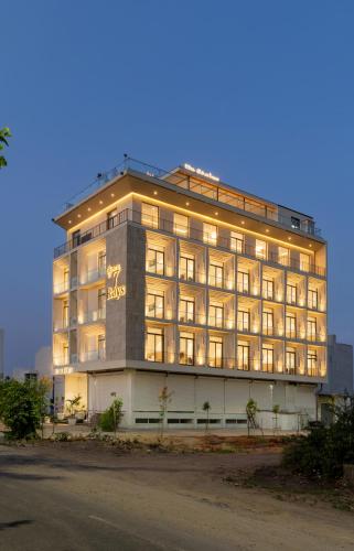 a large building with lights on the side of it at 7 rays hotel in Udaipur