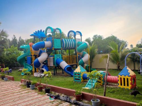 a playground in a park with a slide at Le Roi Digha in Digha