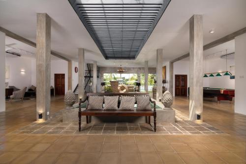a living room with a couch and a piano at Lake Hideaway in Panadura
