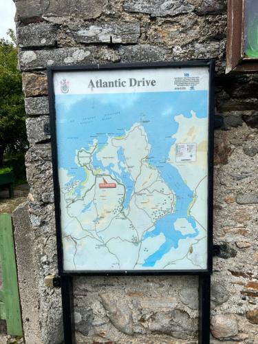 a map of atlantic drive on a stone wall at Marys House in Carrigart