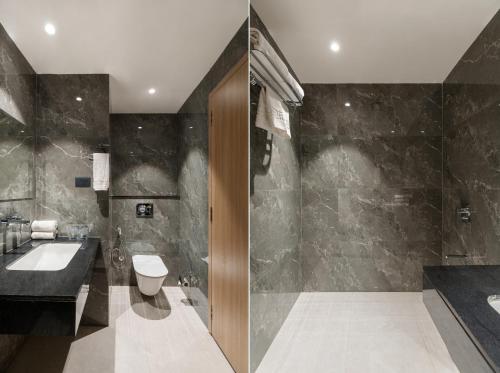 a bathroom with a toilet and a sink at 7 rays hotel in Udaipur