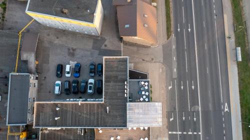 an overhead view of a parking lot with parked cars at Luna Self Check-in Hotel Klaipeda in Klaipėda