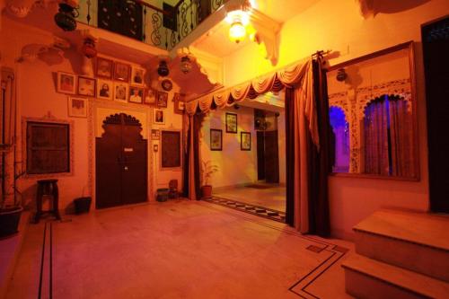 a room with a hallway with a door and a room with a room at Nukkad Guest House Near Lake Pichola in Udaipur