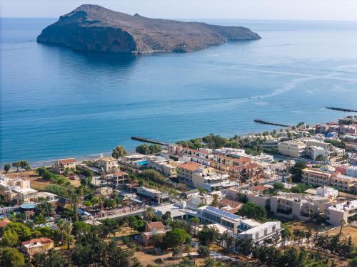 an aerial view of a town next to the water at Phos Hotel Adults Only in Plataniás