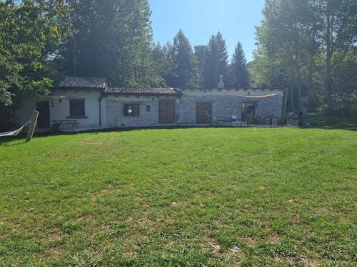 a house in a yard with a large grass field at Dimore Di Charme Lago Matese in San Gregorio