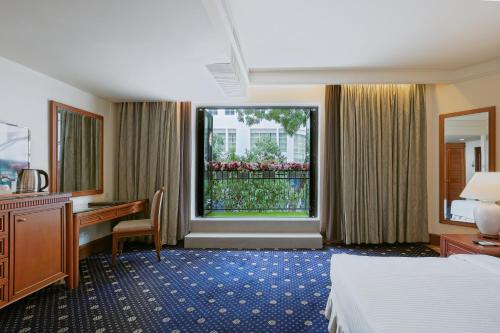 Cama o camas de una habitación en The Jesselton Hotel