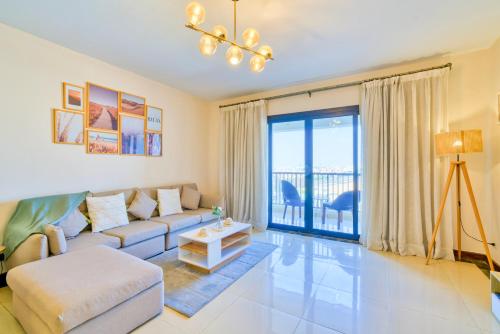 a living room with a couch and a table at LOFTS by Elegant Hospitality in Cairo