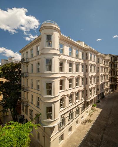 a large white building on a city street at Casa Foscolo Hotel, Istanbul, a Member of Design Hotels in Istanbul