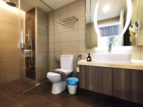 a bathroom with a toilet and a sink and a shower at Genting SmokyStayCationHut AT Ion Delemen in Genting Highlands