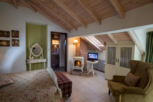 a bedroom with a bed and a fireplace in a room at Atrion Highland Hotel in Elatochori