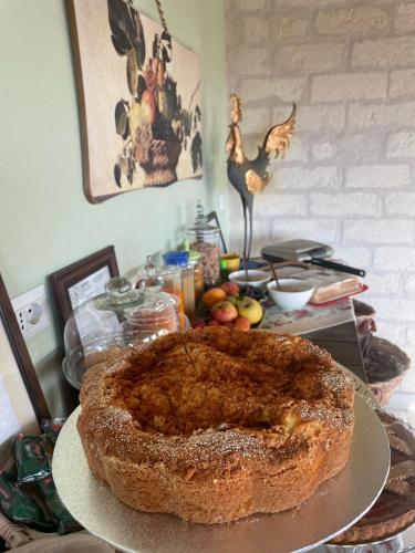 a cake sitting on a plate on a table at Antica Masseria Il Casone in Candela