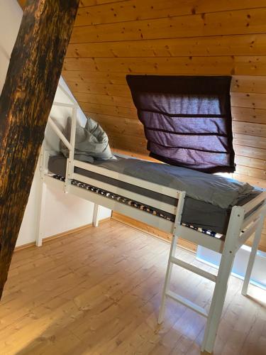 a bunk bed in a cabin with a window at Der Schmidthof in Todtmoos