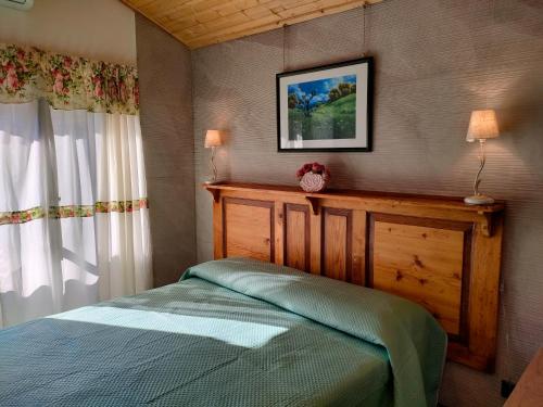 a bedroom with a bed and a window at Casa dell'Antico Ulivo 2 by Holiday World in Nunziata