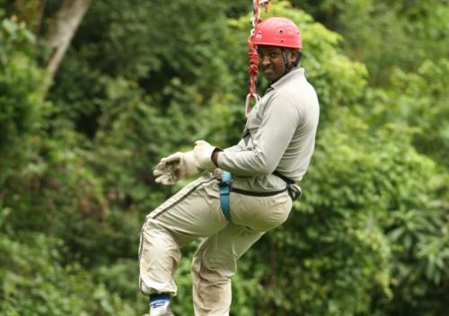 a man in a baseball uniform on a swing at Belihuloya Adventure Camp By Eco Team in Belihul Oya