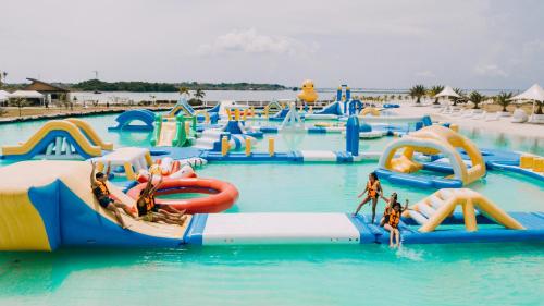 a water park with a bunch of water slides at Solea Mactan Resort in Mactan