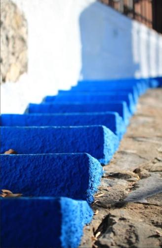 a row of blue steps in front of a building at B&B Terramare in Montiano