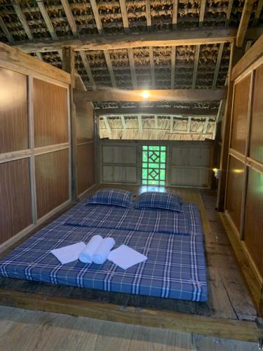 Postel nebo postele na pokoji v ubytování Nặm tha homestay