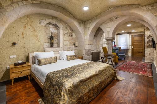 Ένα ή περισσότερα κρεβάτια σε δωμάτιο στο Cappadocia Estates Hotel