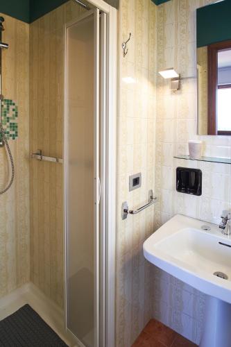 a bathroom with a shower and a sink at Villa Vera in Verbania
