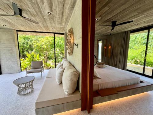 Postel nebo postele na pokoji v ubytování Cape Pakarang Wow Wild Wellness Escapes