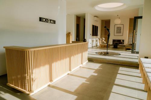 a lobby with a reception desk in a building at Ikigai Retreat Moc Chau in Mộc Châu