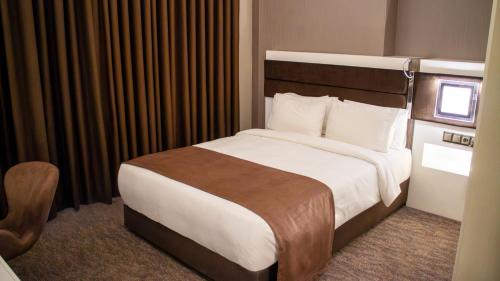 Katil atau katil-katil dalam bilik di Sam Royal Hotel