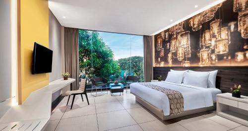 Voodi või voodid majutusasutuse FM7 Resort Hotel - Jakarta Airport toas