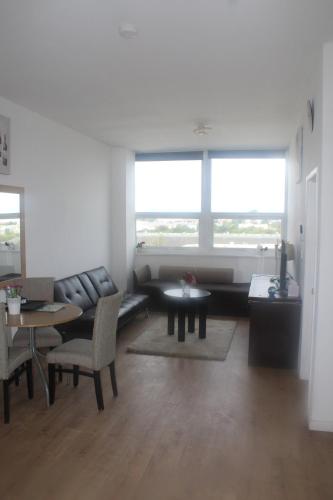 a living room with a couch and a table at Flat 414 One bedroom apartment in Birmingham