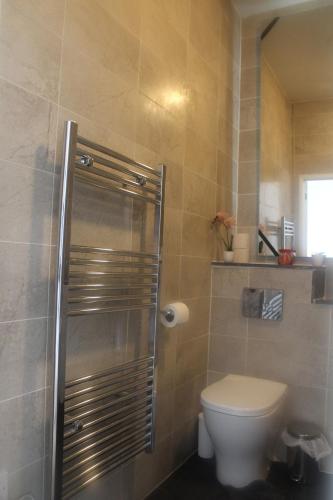a bathroom with a toilet and a shower stall at Flat 414 One bedroom apartment in Birmingham