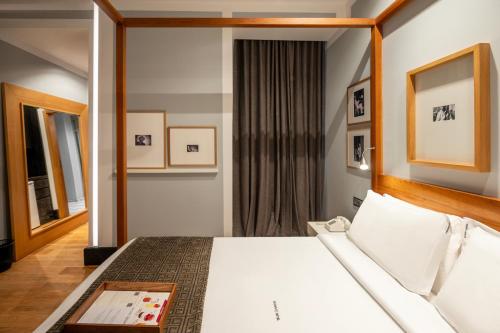 a hotel room with a bed and a window at Browns Downtown Hotel in Lisbon
